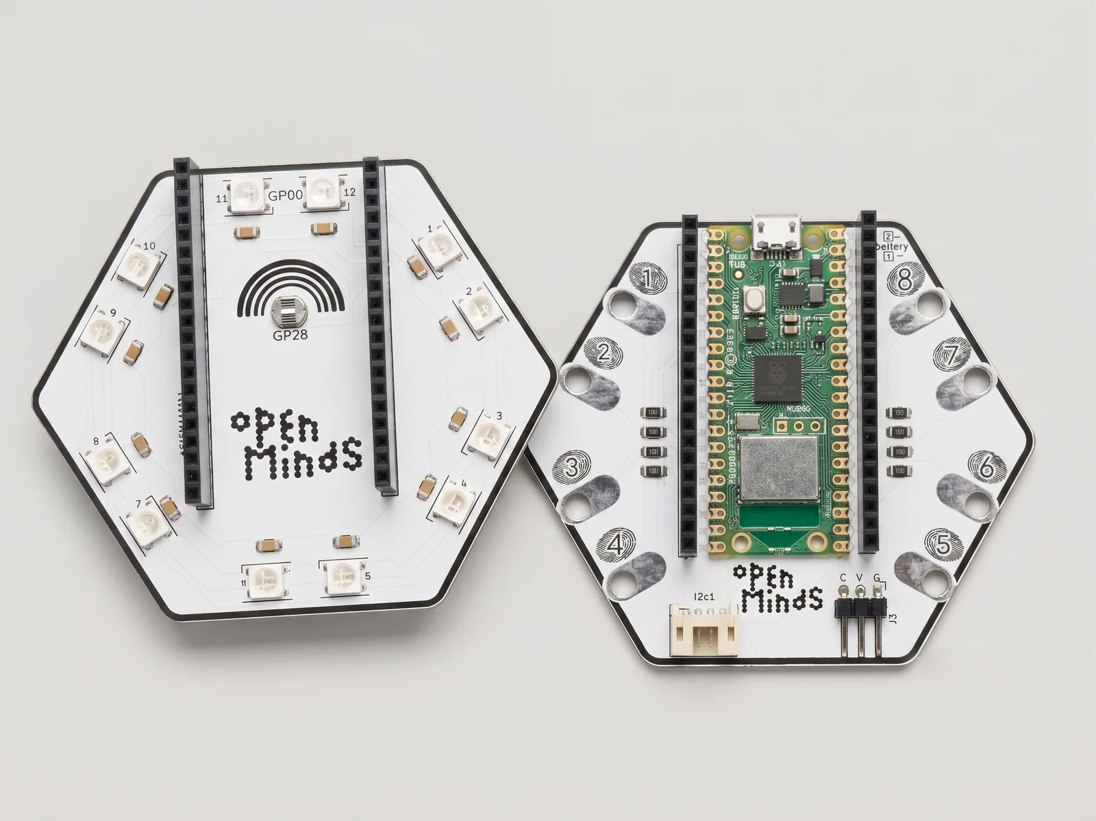 The main board beside a Light hat, both hexagonal, seen from above.