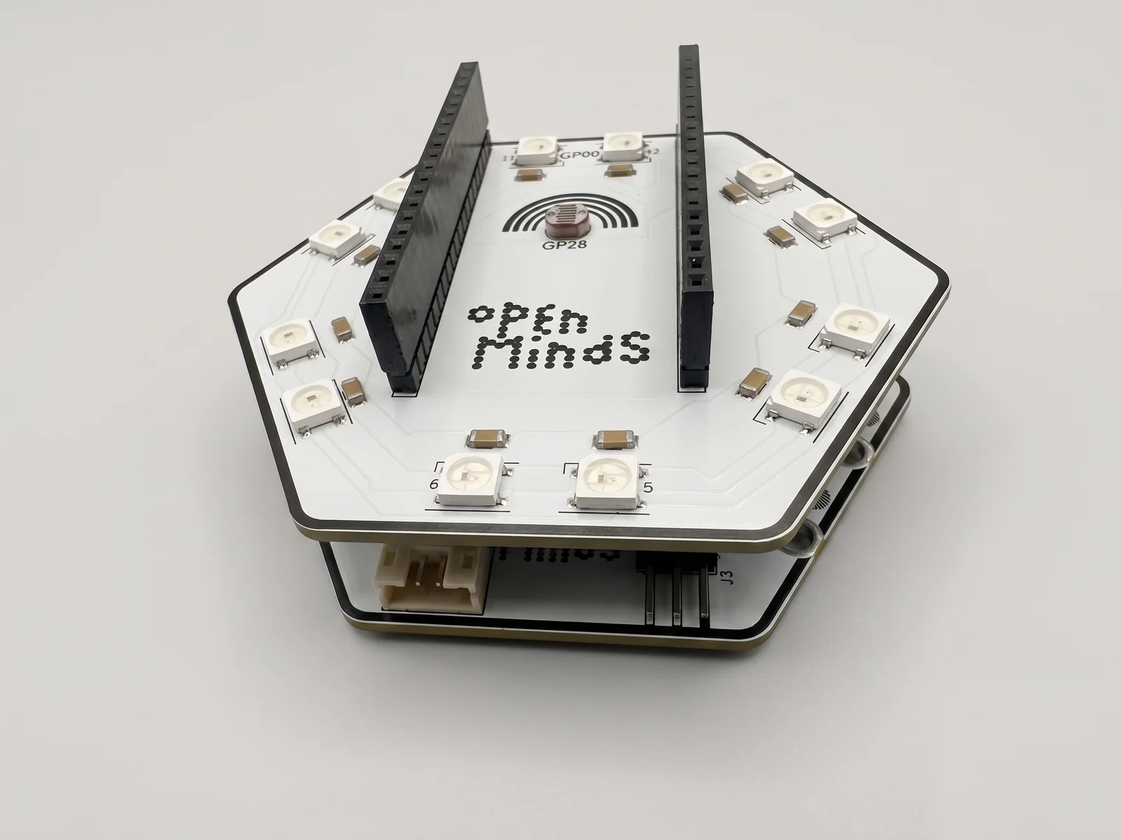The Light and Colour hat stacked on the main board, its ring of addressable LEDs around the dot-matrix Open Minds logo.